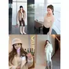 Suéter de punto liso estilo francés con cuello en V para mujer, primavera y otoño, de alta gama, corte ajustado, capa base, top adelgazante para mujer