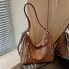 Bolso de hombro versátil de gran capacidad estilo coreano, moda nueva de otoño 2026 transfronterizo, mochila retro de alta gama para el día a día