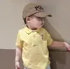 Novo Conjunto de Roupas Infantis Estilo Coreano para Meninos e Meninas, Camiseta Fofa de Manga Curta com Gola Polo e Shorts Listrado Conjunto de Duas Peças