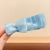 Nuevo y exquisito pasador de pelo con lazo 2026, un accesorio lujoso y de alta gama, con un diseño de pinza de plátano estilo coreano, creando un look dulce y moderno para mujeres