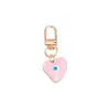 Nueva Joyería Simple Transfronteriza Creativo Colgante de Arena Movediza Ojo del Diablo Colgante de Llavero Metálico con Forma de Corazón Gota de Aceite