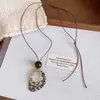 Collar de borlas acrílicas transfronterizo europeo y americano, sensación de lujo ligero y alta gama, cadena para la clavícula con diseño Maillard, joyería de nicho para mujeres