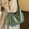 Bolsa de Lona Feminina Outono Inverno 2026 Nova Pequena Design de Nicho Bolsa de Ombro Único Transversal Estilo Coreano Casual Popular Este Ano Bolsa Tote