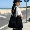 Bolso de Hombro Tejido Hueco de Verano para Mujer 2025 Nuevo Estilo Bolso de Punto con Flor de Hilo Gran Capacidad Bolso Tote