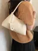 Bolso de mano tejido de nicho coreano para mujer, moda retro casual de moda nuevo otoño 2026, bolso de hombro bajo el brazo