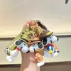 Pingente de chaveiro Snoopy de desenho animado da moda, acessório para bolsa de casal de barraca de rua, pequeno presente para máquinas de garra, atacado