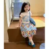 Conjunto Súper Estiloso de Niña Estilo Coreano Verano 2026 Nuevo Modelo, Moda de Top con Estampado de Manga Corta y Falda Floral de Moda para Niñas Pequeñas