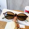 Gafas de sol estilo coreano con montura ovalada retro, cara pequeña, cóncavas y elegantes con estampado de leopardo, gafas de sol de alta gama para mujer, estilo callejero, para chicas atractivas.