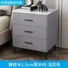 Mesita de noche de madera maciza de lujo ligero pintada en spray tres cajones encimera de roca simple moderna elevada para dormitorio armario de almacenamiento de alta calidad para el hogar