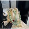 Bolso de paja tejido para mujer, nuevo diseño de nicho, bandolera de verano, bolso de playa para vacaciones en la playa, bolso tipo cubo, 2024