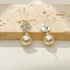 Pendientes de botón con colgante de perla y flor de pintura al óleo de alta gama, joyería versátil de lujo ligero de moda