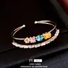 Pulsera abierta de doble capa con circonita chapada en oro real de 18k, sensación de nicho de alta gama, joyería versátil de lujo ligero para el día a día para mujeres