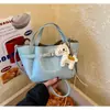 Bolso pequeño cuadrado de moda y versátil, bolso popular para mujer estilo coreano, nuevo modelo 2026, bolso tipo cubo estilo cesta, lujo ligero con sensación de alta gama, diseño de nicho