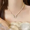 Collar de Suéter con Cuentas y Colgante de Lazo para Mujer 2025 Nuevo Lujo Accesible de Gama Alta Accesorios de Collar para Clavícula de Nicho