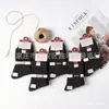 Envío gratis calcetines de invierno de cintura alta desodorantes anti-pilling doble aguja antibacterianos para hombre y mujer mercado mayorista comparable