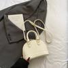 Bolsa Satchel de Nicho com Laço para Mulheres 2025 Nova Moda Primavera e Verão Bolsa Concha com Textura Bolsa Transversal Versátil