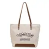 Bolsa de Lona con Letra Bordada para Mujer 2026 Nueva Bolsa Tote de Gran Capacidad para Viajes Diarios Bolso de Hombro Versátil para Estudiantes Uso Casual en Clase