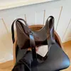 Bolso de mujer de alta gama, nuevo modelo otoño 2026, bolso de axila para el día a día, diseño de nicho moderno y simple, bolso de hombro y cruzado