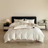 Juego de ropa de cama de cuatro piezas jacquard teñido en hilo 100% algodón, sábana y funda de edredón de lujo ligero de alta gama, estilo para todas las estaciones, venta al por mayor