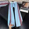 Pantalones deportivos de punto gofre estilo americano a rayas de bloques de color para hombre, corte ajustado, pierna recta, pierna ancha, pantalones casuales para otoño