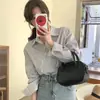 Camisa top de manga longa listrada com botões diagonais irregulares, design retrô francês estilo coreano, moda nicho para mulheres 18456