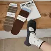 Calcetines de estilo universitario color caramelo marrón con bloques de color y estampado de rombos estilo coreano, nueva colección de otoño, calcetines hasta la pantorrilla con estampado floral, calcetines de algodón holgados