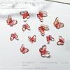 Libro Rojo pequeño mismo estilo color mágico Mabei mariposa tallada joyería para uñas Mariposa Aurora joyería para uñas accesorios de mariposa