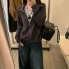 Foto real del nuevo cárdigan de dos piezas sintéticas para mujer otoño 2026, un nuevo diseño de otoño con un top único, holgado, adelgazante y de manga larga