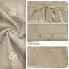 Sitio web independiente transfronterizo de lino con cordón cintura elástica pierna recta TK color sólido transpirables diarios playa casual pantalones cortos cortos para hombre