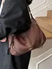 Bolsa Feminina Transfronteiriça Estilo Bolinho Feminina Versátil para o Dia a Dia Bolsa Transversal Bolsa Meia-Lua 2026 Nova Bolsa de Ombro em Camurça Bolsa de Axila