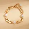 Pulseira de Corrente Oval com Pérolas Artificiais Banhada a Ouro 18K Estilo Europeu e Americano Moda Elegante Retrô Joia de Mão de Alto Padrão para Mulheres