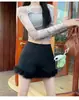 Shorts peludos negros con botas para mujer, nuevos de otoño e invierno 2026, de cintura alta, de nicho, línea A, shorts ajustados para usar como prenda exterior