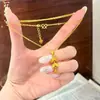 Nuevo collar de borla estilo chino con nariz de cerdo de filigrana antigua chapado en oro con cadena para la clavícula de hoja de abanico adornada con diamantes, sensación de alta gama, color duradero
