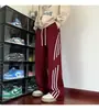 Pantalones de Chándal Largos para Hombre Otoño 2026 con Tres Rayas Laterales y Diseño Elegante