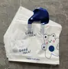 Atacado bonito urso de lã nova embalagem de plástico portátil presente saco de compras de roupas roupas infantis saco de caixa de sapato