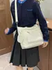 Bolso de hombro versátil de color liso, nuevo para el otoño de 2026, bolso tote de gran capacidad, bolso cruzado para estudiante y para el día a día, transfronterizo
