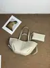Bolsa de ombro de couro genuíno de grande capacidade para mulheres, nova bolsa tote casual 2026 com padrão de lichia texturizado, bolsa de antebraço fashion