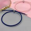 Pareja japonesa y coreana hebilla de acero de titanio ajustable cuerda de mano multicolor resistente al desgaste pulsera tejida fabricantes venta al por mayor colgante DIY