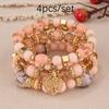 Pulsera de borlas con colgante de amor hueco multicapa de estilo bohemio de venta caliente europeo y americano, juego de joyería multicapa con cuentas de vidrio