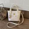 Bolsa de Ombro Casual de Nicho Nova Primavera 2026 para Mulheres, Bolsa Transversal Estilo Balde Doce de Grande Capacidade, Simples e Estilosa