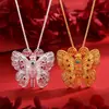 Wei Xue con el mismo estilo colgante de mariposa hueca de esmalte dorado antiguo para suéter collar colgante femenino venta al por mayor