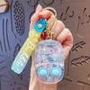 Juego Creativo para Aliviar el Estrés Llavero de Máquina de Agua Dibujo Animado Divertido Lindo Juguete Pequeño Colgante para Mochila de Estudiante Regalo Venta al por Mayor