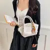 Bolso tipo cubo sencillo para ir al trabajo para mujer 2026 Nuevo modelo Bolso de mano de un solo hombro Textura de alta calidad Diseño de nicho Bolso de axila