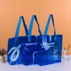 Bolso de mano de PVC con láser de color mágico, logotipo engrosado, bolsa de embalaje de TPU transparente, bolsa de regalo de gelatina de plástico