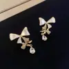 Pendientes de Aguja de Plata 925 Otoño e Invierno para Mujer Mariposa Estilo de Alta Gama Moda Barroco Zircón Pendientes de Gancho con Borla