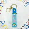 Llavero Creativo de Dibujos Animados Color Transparente Arcoíris PVC Goma Suave Cuerda de Cuero Muñeco Bolso Colgante Accesorios Botella de Aceite a la Deriva