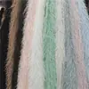 Terciopelo de hadas con borlas en stock, terciopelo de aguja de pino de pelo largo, terciopelo Xiangfei, tela para cojines, juguetes, vestidos de moda para mujer