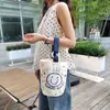 Venta al por mayor del fabricante Bolso de mano artístico de moda Bolso de lona Bolso tipo cubo de gran capacidad para mujer 2026 Nuevo Bolso para almuerzo de trabajo