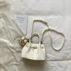 Bolsa de Mão Elegante Tecida para o Trabalho Feminino, Nova Moda Primavera/Verão 2026 Versátil para Ombro e Transversal
