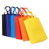 Bolsa no tejida al por mayor engrosada protección ambiental bolso de mano promocional impresión de logotipo en stock vertical embalaje no tejido horizontal